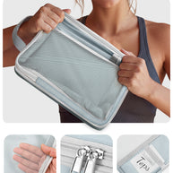 Person holding a gray travel pouch with mesh side, showing tear resistance feature.